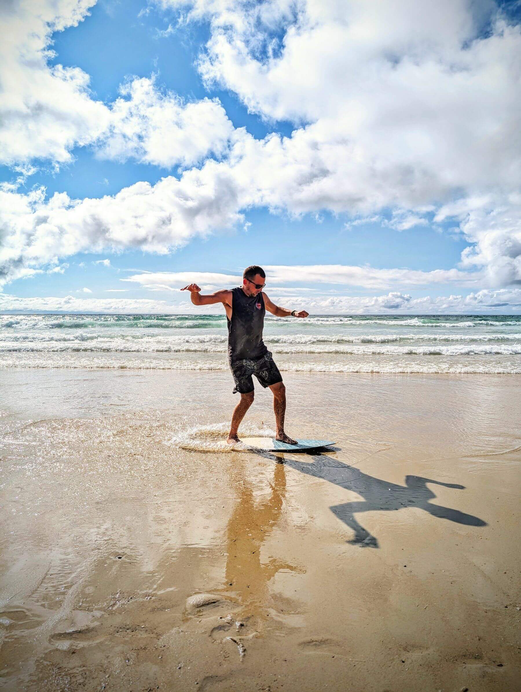 Johannes on a skimboard